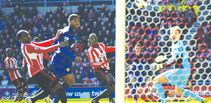 Manchester Unitedu2019s Robin Van Persie (second from right) shoots to score against Sunderland during their English Premier League match in Sunderland ye