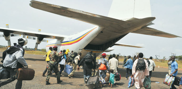 Displaced Muslims, from the Central African Republic, Chad and other countries, fleeing attacks by Christian extremist militias rush to board a plane 