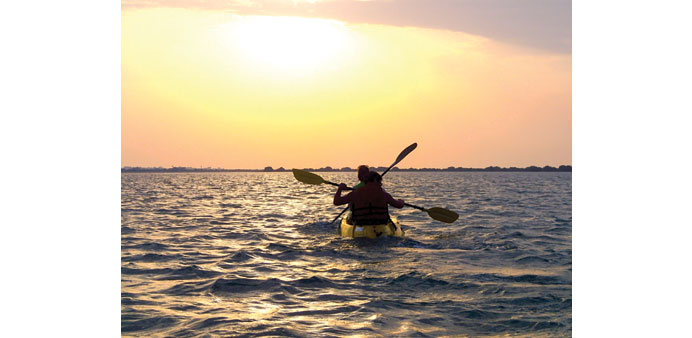 CALM: Sun sets as a group paddles in Qatar.         Photo courtesy of Entalek