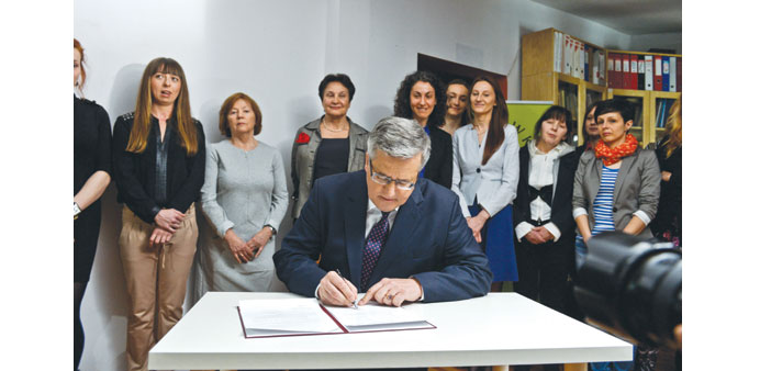  Komorowski ratifying the Council of Europe Convention on preventing and combating violence against women and domestic violence in Warsaw.