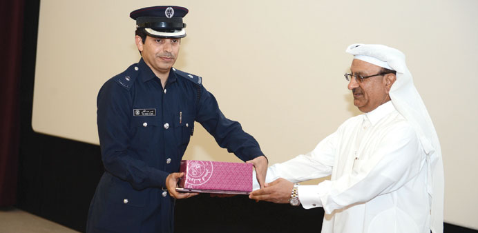 A cadet receiving his certificate from Major General Dr Abdullah Yusuf al-Mal.
