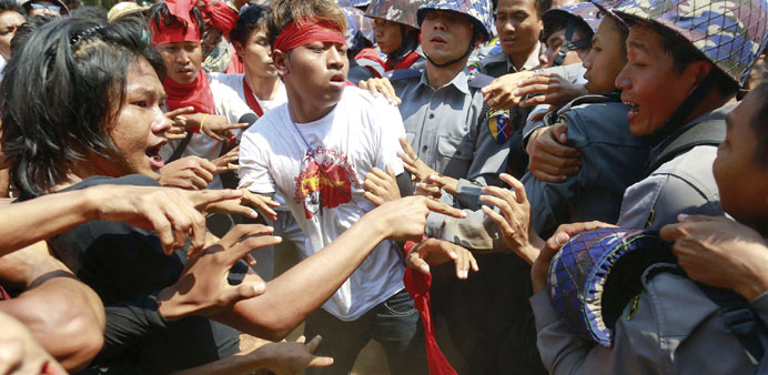 Police clash with student agitators during a protest in Letpadan yesterday.