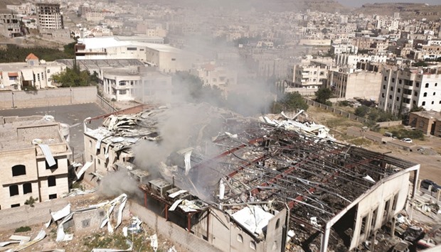 Smoke rises from the community hall which came under air strike in Sanaa on Saturday.