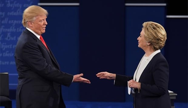 Hillary Clinton and Donald Trump shakes hands after the second presidential debate at Washington University in St. Louis, Missouri, on Sunday.