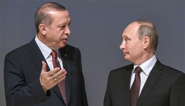 Russian President Vladimir Putin listens to Turkish President Recep Tayyip Erdogan during the 23rd World Energy Congress in Istanbul on Monday.