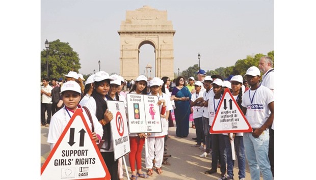 Girls manage traffic at India Gate in New Delhi yesterday.