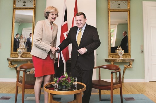 Prime Minister Theresa May meets Danish Prime Minister Lars Lokke Rasmussen, at Marienborg estate in Lyngby outside Copenhagen, Denmark, yesterday.