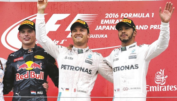 Mercedes drivers Nico Rosberg (centre), Lewis Hamilton (right) and Red Bullu2019s Max Verstappen on the podium after Sundayu2019s Japanese Grand Prix. (Reuters)