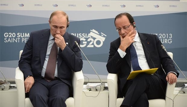 Francois Hollande and Vladimir Putin are seen during the G20 summit in Saint Petersburg in this 2013 file picture.