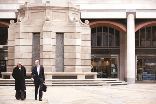 Pedestrians walk across Paternoster Square in front of the London Stock Exchange headquarters. Some FTSE 100 companies that donu2019t have much to gain from the lower pound have still benefited from the indexu2019s broad rally.