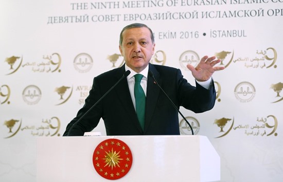 Turkish President Recep Tayyip Erdogan delivering a speech during the opening ceremony of 9th Eurasian Islamic Council in Istanbul yesterday.