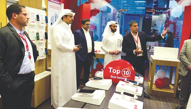 Hamad al-Thani and other officials at the opening of the store.