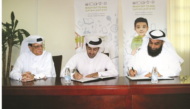 Officials of Rota and AFIF Charity sign the MoU.