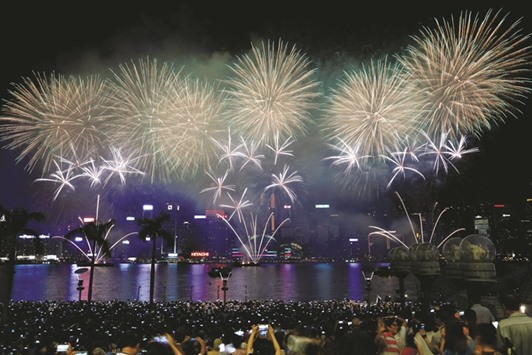 Thousands watch last night as fireworks explode over Hong Kongu2019s Victoria Harbour.