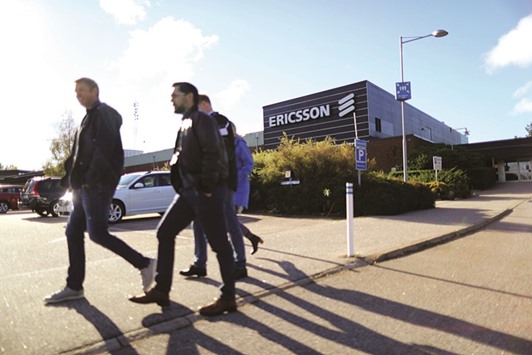 Workers walk outside the Ericsson factory in Boras. The Swedish company is struggling with a drop in spending by telecoms companies, with new 5G technology still years away, and stiff competition from Nokia and Huawei.