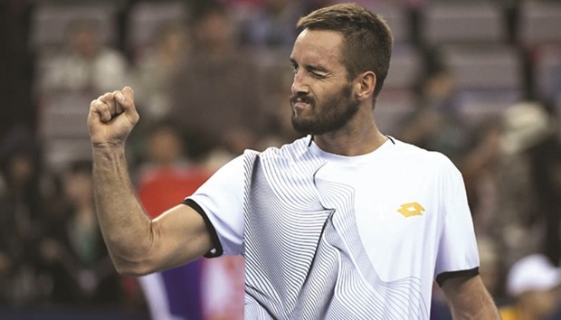 Viktor Troicki of Serbia celebrates after winning his match against Rafael Nadal of Spain at the Shanghai Masters tennis tournament in Shanghai yesterday. (AFP)