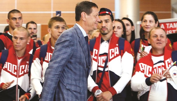 Russian Olympic Committee (ROC) chief Alexander Zhukov walks past Russiau2019s Olympic team members during a farewell ceremony before the national teamu2019s departure to 2016 Rio Olympics at Sheremetyevo International Airport outside Moscow, Russia, on July 28, 2016. (Reuters)