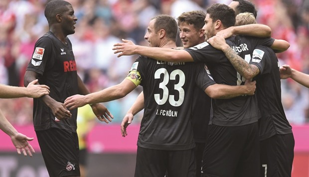 Cologneu2019s players celebrate after the Bundesliga match against between FC Bayern Munich in Munich yesterday. (AFP)