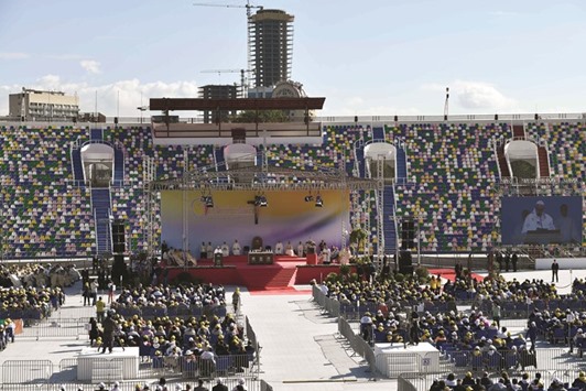 Pope Francis (centre) celebrating a Holy Mass yesterday at the mostly-empty stadium in Tbilisi.