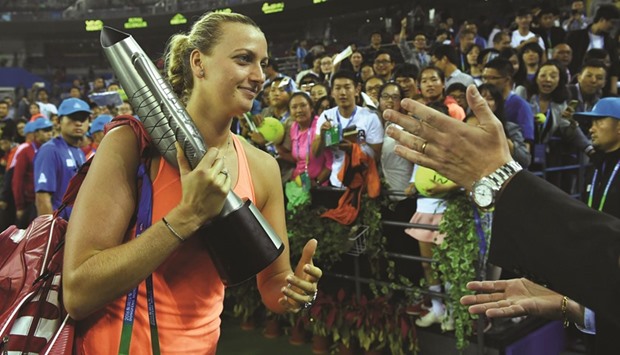 Petra Kvitova of the Czech Republic is applauded as she leaves the court after winning the final of the WTA Wuhan Open tennis tournament against Dominika Cibulkova of Slovakia yesterday.