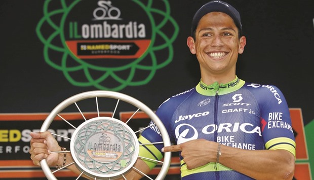 Colombian Esteban Chavez celebrates on the podium after winning the 110th edition of the giro di Lombardia (Tour of Lombardy), a 241 km cycling race from Como to Bergamo in Italy. (AFP)