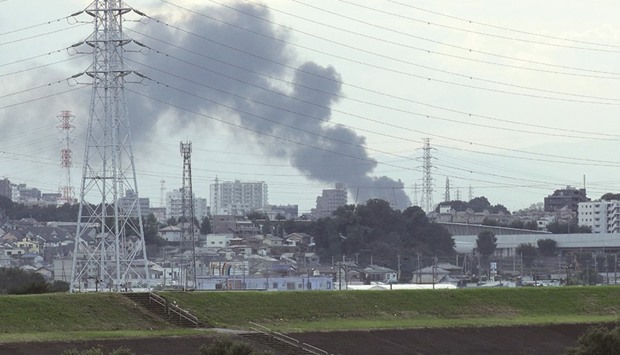 Smoke rises from a fire at a facility run by utility Tokyo Electric Power in Niiza, Saitama prefecture yesterday.