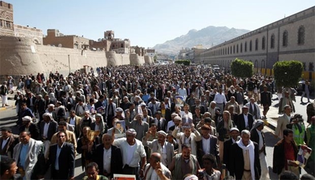 Mourners take part in the funeral of Abdul Qader Helal, the mayor of Sanaa, who was killed by an apparent Saudi-led air strike that ripped through a wake attended by some of the country's top political and security officials in Sanaa.