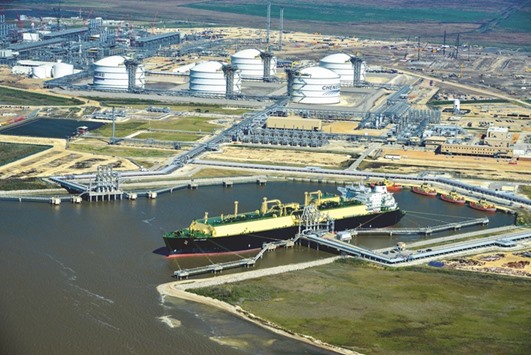 An LNG carrier is docked at Cheniere Energyu2019s terminal in this aerial photograph taken over Sabine Pass, Texas, US. The additional volumes of LNG will come at a testing time for the global market, which is reeling from a worldwide glut thatu2019s set to worsen through 2020 as demand from key Asian customers slows.
