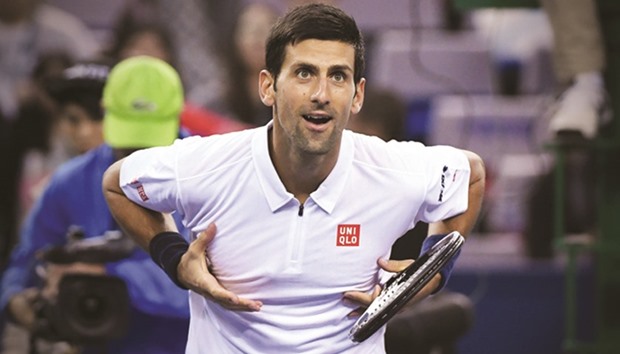 Serb Novak Djokovic celebrates his win over Vasek Pospisil of Canada at the Shanghai Masters yesterday. (AFP)