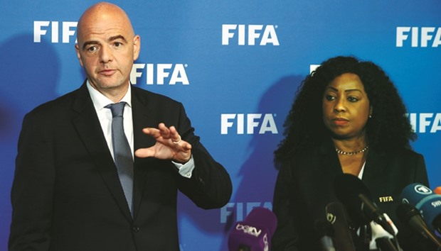FIFA president Gianni Infantino and secretary general Fatma Samoura address the media after a meeting of the FIFA Council in Zurich yesterday. (Reuters)