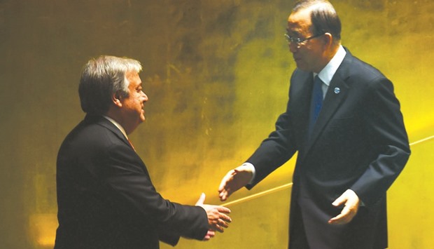 Outgoing UN Secretary General Ban Ki-moon shakes hand with Secretary General-designate Antonio Guterres during the ceremony at the 70th session of the UN General Assembly at the United Nations in New York.