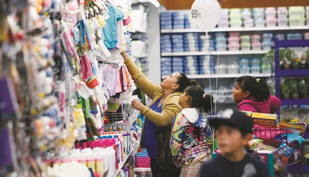 Customers shop for baby clothing at a 99 Cents Only Store in San Bernardino, California. The US Commerce Department yesterday said retail sales increased 0.6% after declining 0.2% in August.