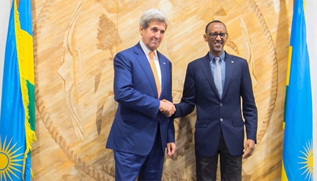 Rwanda President Paul Kagame (R) and the US Secretary of State John Kerry