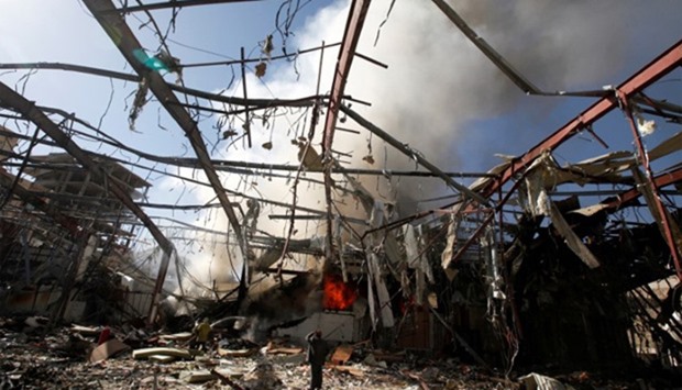 Smoke rises at a community hall where Saudi-led warplanes struck a funeral in Sanaa