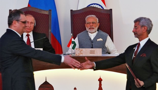 Russian President Putin and India's PM Modi attend an exchange of agreements
