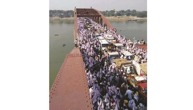 A large number of people are seen on the Rajghat bridge before the deadly stampede occurred yesterday.