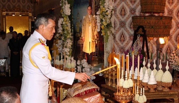 Thailand's Crown Prince Maha Vajiralongkorn takes part in a ceremony in honor of his father