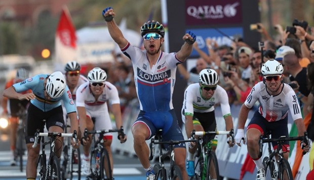 Slovakia's Peter Sagan celebrates after winning the men's elite road race event as part of the 2016 UCI Road World Championships on October 16, 2016, in the Qatari capital Doha