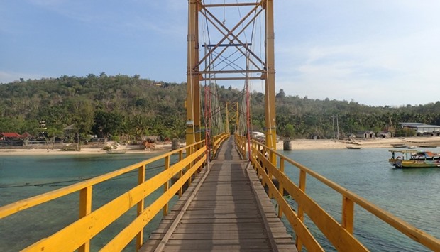 The ,Yellow Bridge, which connects Nusa Lembongan and Nusa Ceningan, two islands located east of the resort island of Bali, Indonesia is seen November 29, 2015. Reuters