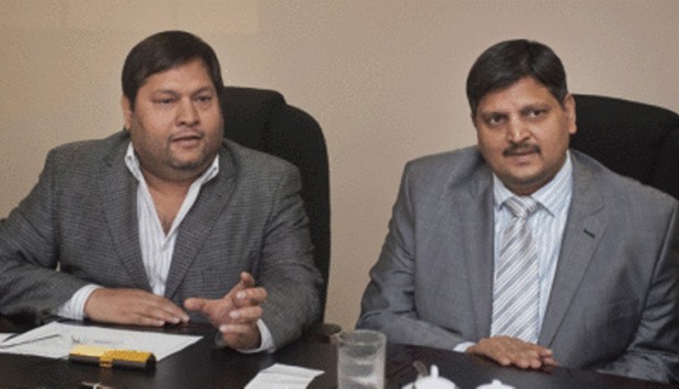 Indian businessmen Ajay Gupta (R) and younger brother Atul Gupta in Johannesburg on March 2, 2011