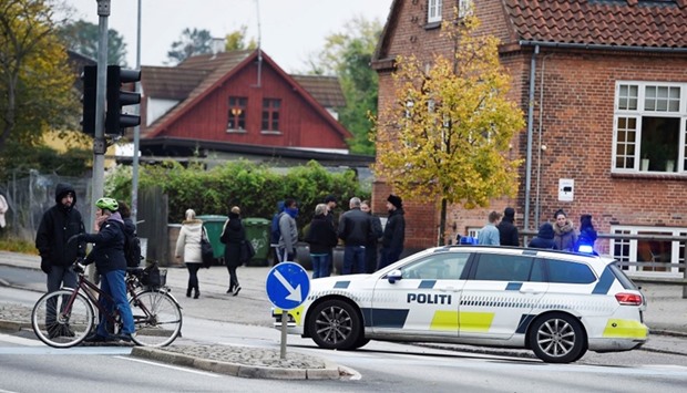 Police block the entrance to RO's Torv, a shopping centre in downtown Roskilde, Denmark