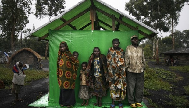 A group of pygmies shelter from the rain in Mubambiro village near Goma, Democratic Republic of Congo. File picture.