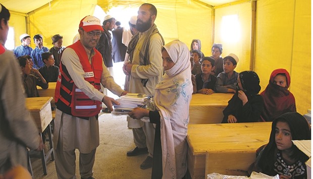 QRCS  personnel providing relief to the needy in Afghanistan.