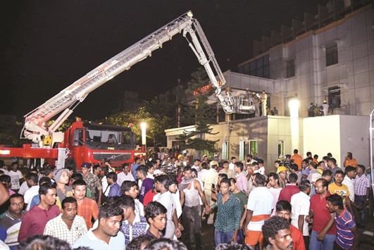 Rescue workers trying help victims of the massive fire at the SUM Hospital in Bhubaneswar.