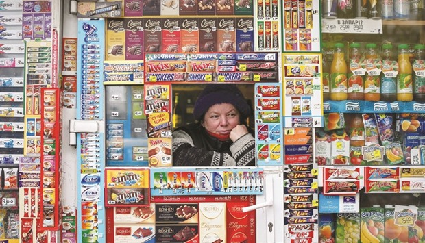 STILL WAITING: A street vendor waits for customers in central Kiev.