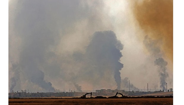 A picture taken yesterday from the village of Shaqouli, about 35km east of Mosul, shows smoke billowing from the city of Nineveh as Iraqi forces take part in an operation against the Islamic State (IS) group militants. With the crucial battle in its second day, Iraqi commanders said progress was being made as fighters pushed on two main fronts against the militantsu2019 last stronghold in Iraq.