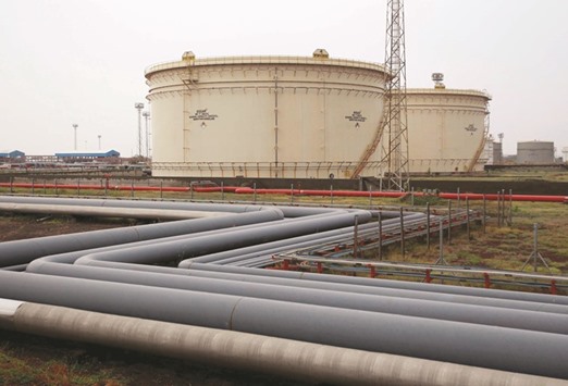 Storage tanks of Essar Oil are seen in Vadinar, Gujarat. Rosneft, Russiau2019s biggest oil company led by Putinu2019s close ally Igor Sechin, will buy 49% of the Indian refiner.