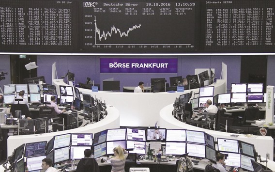 Traders at the Frankfurt Stock Exchange. The DAX 30 gained 0.1% to 10,645.68 points yesterday.