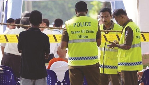 Sri Lanka police exhume body of former army spy over murder.