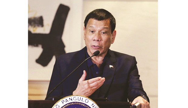 President Rodrigo Duterte attends a news conference during his visit in Beijing yesterday.